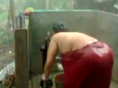 Amateur unsightly Indian fatso tries to take a shower right outdoors